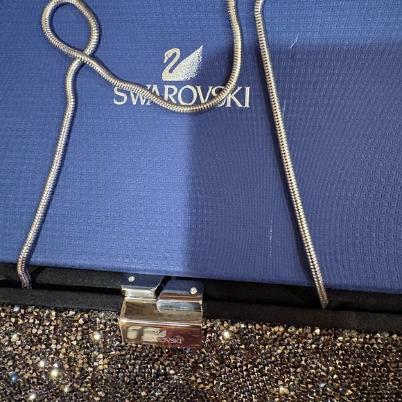 Swarovski Crystal-Embellished Black and Silver Clutch
New in original box - Picture 4 of 5